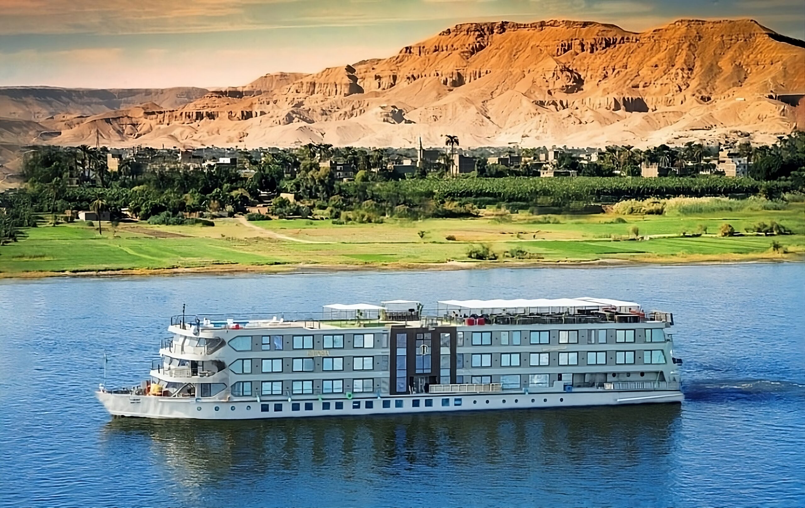 Luxurious Nile River cruise with scenic desert backdrop
